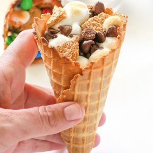 Campfire Cones - If you don't want to deal with someone poking their eye out, make your s'mores in a waffle cone, wrap it in foil, and toss it in the campfire until melted! the-girl-who-ate-everything.com